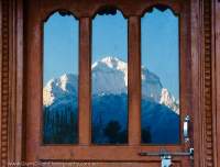 Reflection of Dhaulagiri (8167m) in door of trekkers' lodge, Annapurna Circuit Trek