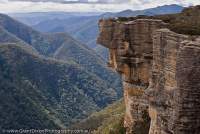 AUSTRALIA, NSW, Blue Mountains, Kanangra-Boyd National Park. Sandstone cliffs of Kanangra Walls, Kanangra Deep below, Greater Blue Mountains World Heritage Area.