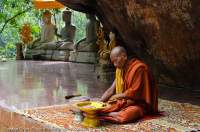CAMBODIA, Siem Reap. Monk at Wat Preah Ang Thom, Phnom Kulen.
