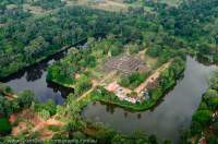 CAMBODIA, Siem Reap.  Ruin of Bakong temple, with surrounding moat, Roluos Group. Aerial view from ultralight aircraft.
