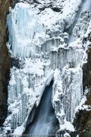 NEPAL, Dolpo. Part-frozen waterfall below Nagdala La (Kang La, 5300m).