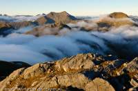 NEW ZEALAND, Fiordland National Park. Cascading cloud at dawn, Heath Mountains.