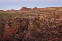 AUSTRALIA, Northern Territory, Keep River National Park. Layered sandstone dome features, formed at edge of escarpment, sunrise.