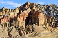 NEPAL. Coloured strata within eroding cliff face, Mustang.