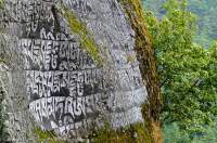 NEPAL. Sagamartha National Park. Buddhist mantras carved into trailside rocks, Dudh Kosi valley, Everest Basecamp Trek.