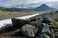 NORWAY, Troms, Lyngsalpan (Lyngen Alps). Glacial erratic boulders (of serpentinite rock), Kalddalen valley.