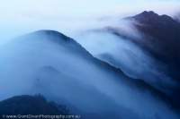 Dawn mist over ridge crest, Star Mountains, Papua New Guinea.