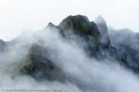Cloud gathering around southern summits of Mt Scorpio, Star Mountains, Papua New Guinea.