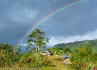 Rainbow over Bakonabip vilage, below the Hindenburg Wall, Papua New Guinea.
