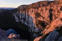 AUSTRALIA, Tasmania, West Coast Range. Conglomerate cliffs above Lake Huntley, a glacial cirque excavated during past ice ages, Tyndall Range.