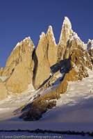 ARGENTINA, Patagonia. Granite spires of Cerro Torre and subsidiary peaks at head of Circo de los Altares, sunset.