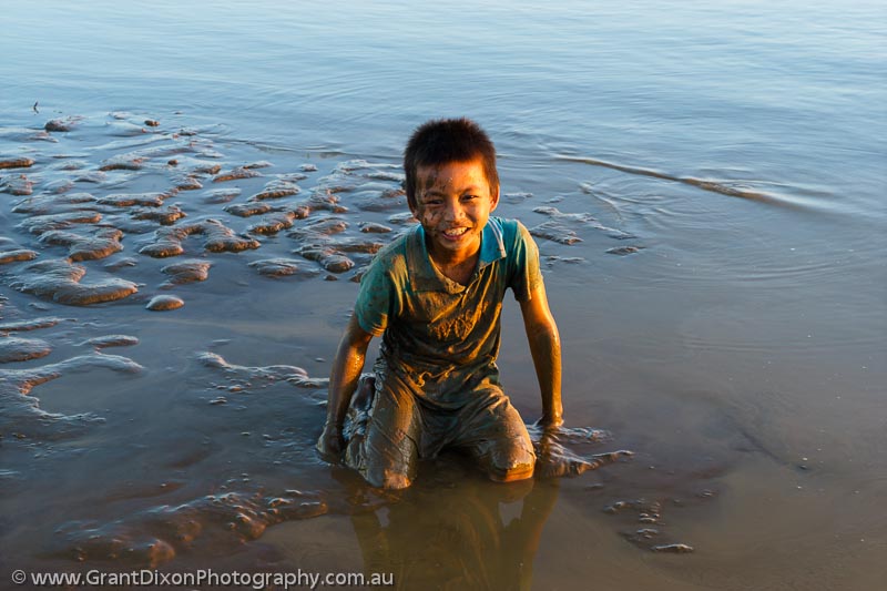 image of Boy playing in river