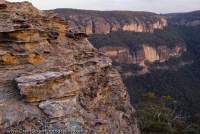 AUSTRALIA, NSW, Blue Mountains, Wollemi National Park. Sandstone cliffs at sunset, Wolgan Valley, Greater Blue Mountains World Heritage Area.