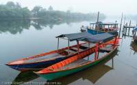 Moored boats on Piphot River, Chi Phat, Cambodia.