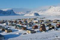Pangnirtung Inuit village,on shore of frozen Pangnirtung Fiord in spring.