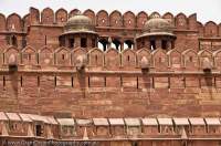INDIA, Uttar Pradesh, Agra. Red sandstone walls of Agra Fort, rebuilt in present form from 1573 by Mughul emperor Akbar; the most important fort in India, where the great Mughul emperors lived and governed India from; a World Heritage site.