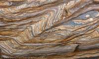 Tightly-folded bedding in Banded Iron Formation, Munjina Gorge, Hamersley Range, Karijini National Park, Western Australia.