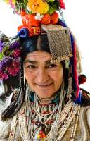 Woman in traditonal costume, with flower-decorated headgear, Ladakh Festival, Leh, 2013