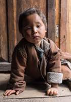 Child in doorway, Manaslu Circuit trek, Nepal