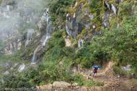 Trekker on acent to Chhokang Paro, Tsum Valley, Manaslu Circuit, Gorkha, Nepal
