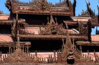 Decorative roof carvings at Shwe In Bin Kyaung, carved teak monastery commissioned by wealthy Chinese jade merchants in 1895.