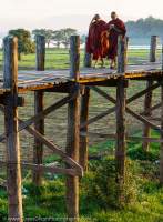 Monks crossing U-Bein bridge, at 1200 metres the world's longest teak foot bridge.