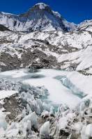 NEPAL. Frozen pool & ice pinnacles, Hunku Glacier, Chonku Chuli (6800m)  beyond, Makalu - Barun National Park.