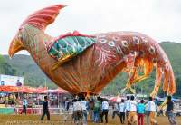 Launching bird balloon at 2014 fire (hot air) balloon festival in Taunggyi, part of full-moon celebrations during Tazaungmon (Tazaungdaing).