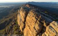 Wilpena Pound wall, from St Mary Peak (Ngarri Mudlanha, 1170m), Flinders Ranges National Park. Sunrise.